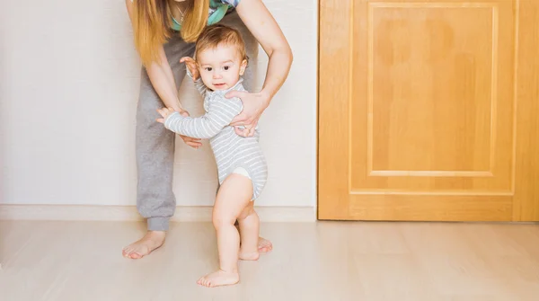Little child baby smiling making first steps — Stock Photo, Image