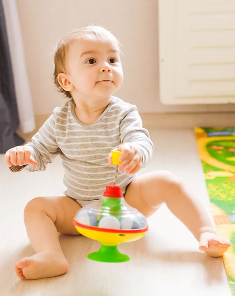 Funny boy kid playing with toy — Stock Photo, Image