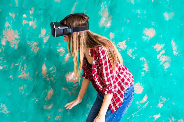 Woman in virtual reality helmet. VR glasses.