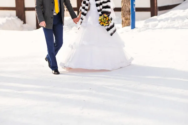 Bride and groom on their winter wedding