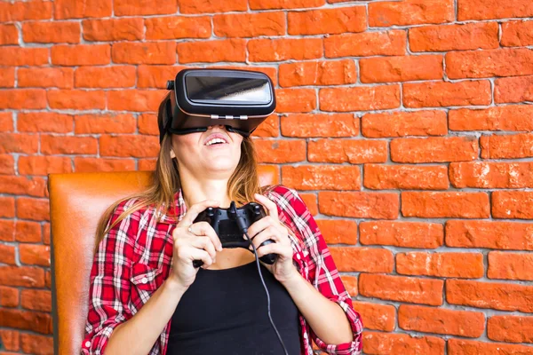 technology, gaming, entertainment and people concept - young woman with virtual reality headset, controller gamepad playing racing video game.