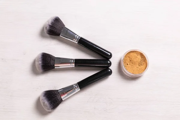 Mineral face powder and brush. Eco-friendly and organic beauty products