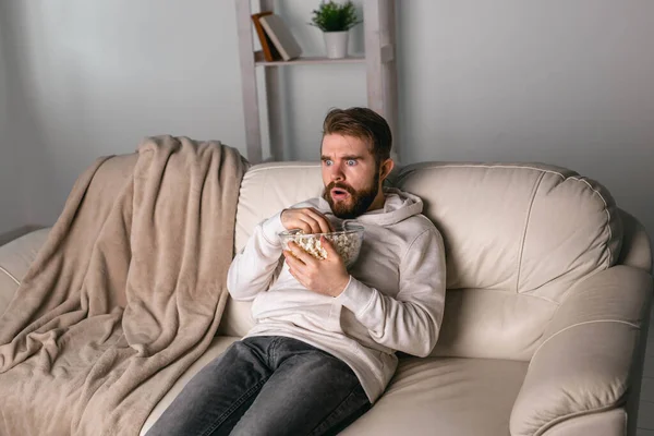 Portrait of guy watching TV series online. Online cinema and video streaming service concept. — Stock Photo, Image