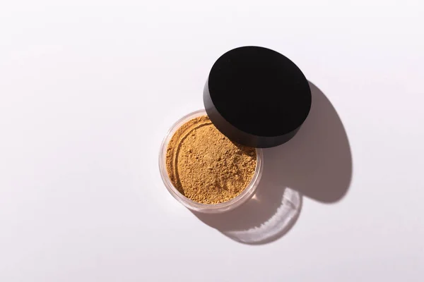 Mineral powder foundation isolated on a white background. Eco-friendly and organic beauty products