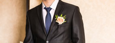 man in a suit with boutonniere clipart