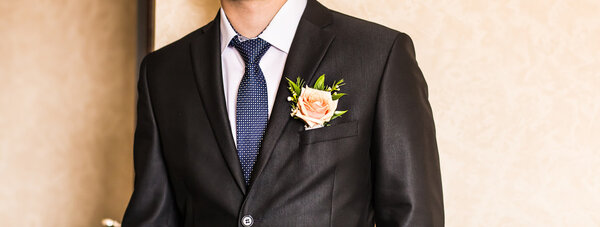 man in a suit with boutonniere