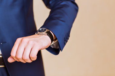 mens hand with a watch. clipart