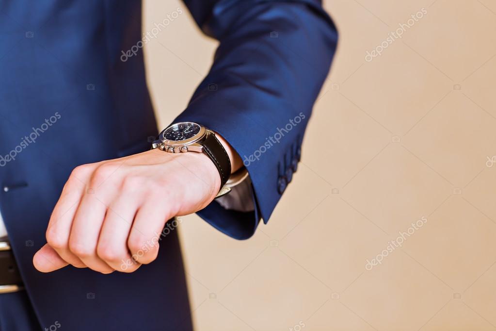 Mens hand with a watch. Stock Photo Satura 78352426