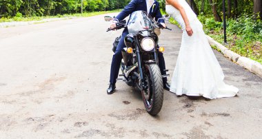 Wedding couple  on motorcycle. clipart