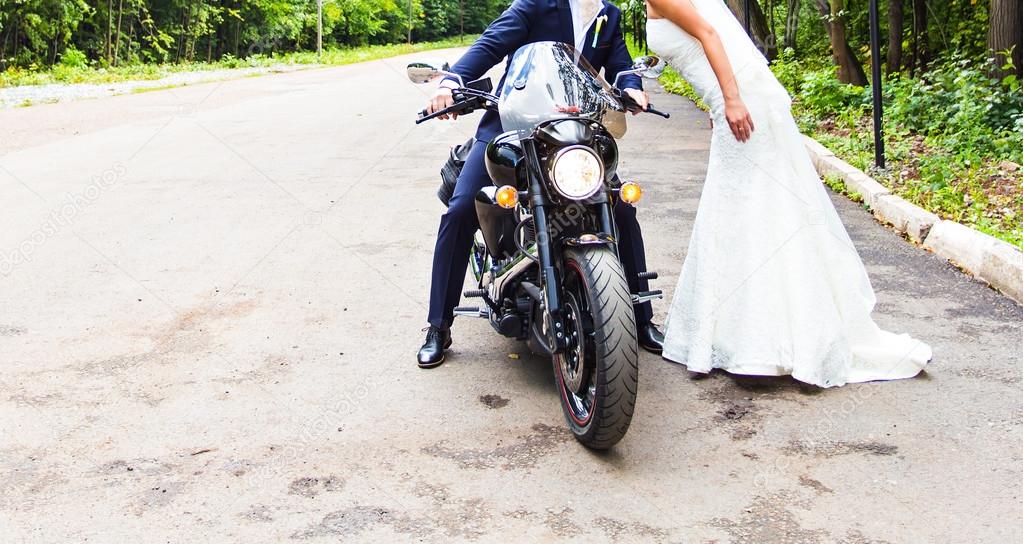 Wedding couple  on motorcycle.