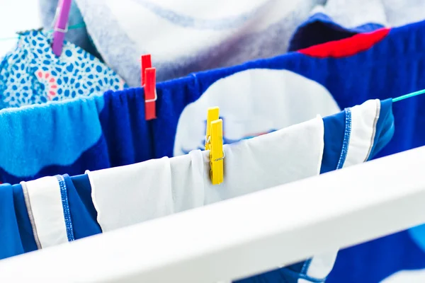 Colorful clothespin hanging on rope — Stock Photo, Image