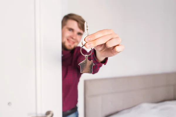 Holding out house keys. Housewarming — Stock Photo, Image