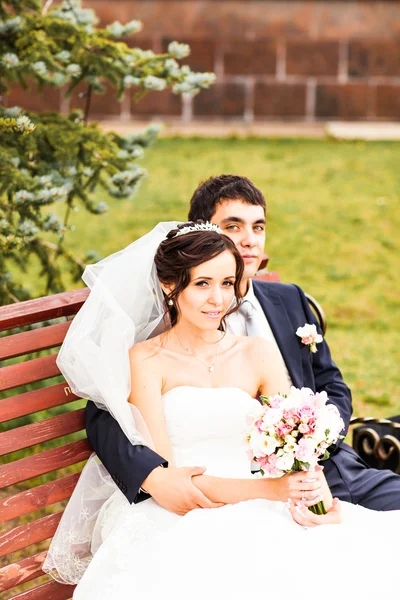 Young wedding couple walking together at park — Stock Photo, Image