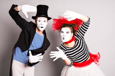 Two mimes man and  woman. April Fools Day concept clipart