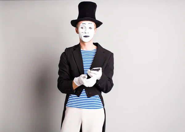 Mime with smartphone. Concept of  April Fools Day. — Stock Photo, Image