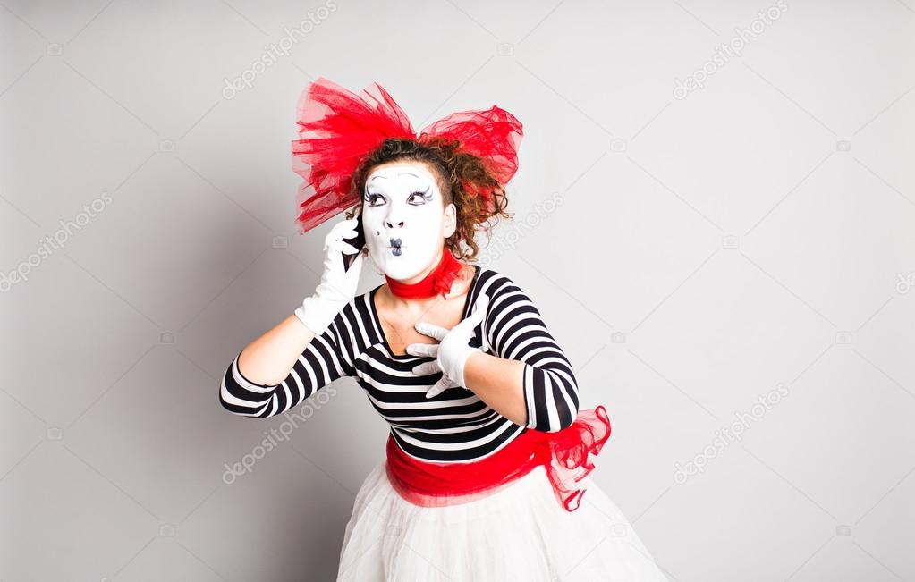 mime with smartphone. Concept of  April Fools Day.
