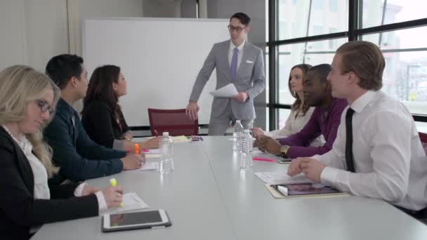 Attractive professional men and women are involved in a meeting — Stock Video