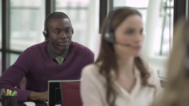 Scene from a customer support or call center — Stock Video