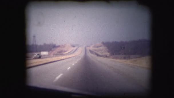Vintage 8mm footage film through the window of a car or truck — Stock Video
