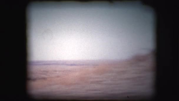 Vintage 8mm footage filmed through the window of a car — Stock Video