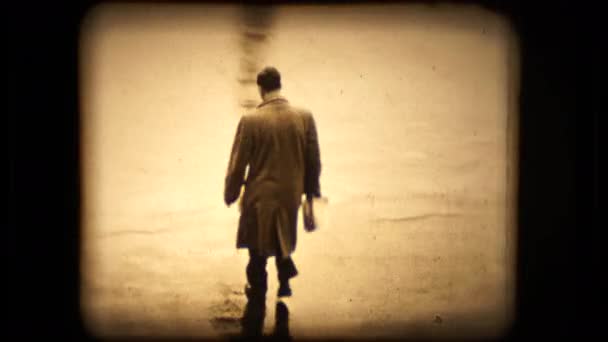 A man walks to his TR2 Triumph on a rainy Paris morning in 1955 — Stock Video