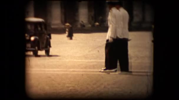 Unknown Italian military guards or police cross a street in antique footage — Stock Video