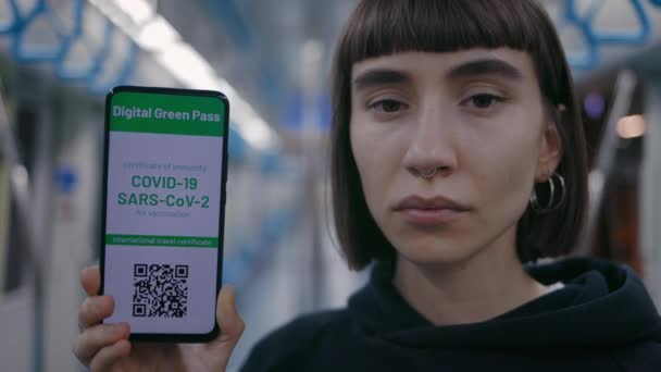 Woman showing digital green pass on cell phone after vaccine — Stock Video