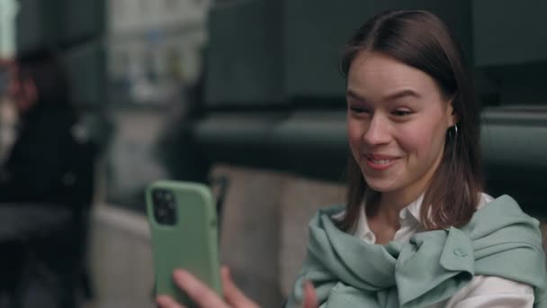 Happy deaf female person having video call on smartphone — Stock Video