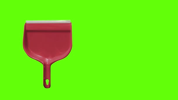 Scoop Plastica Colore Rosso Uno Sfondo Verde — Video Stock