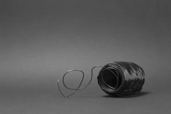 Metal Wire On a grey background — Stock Photo, Image