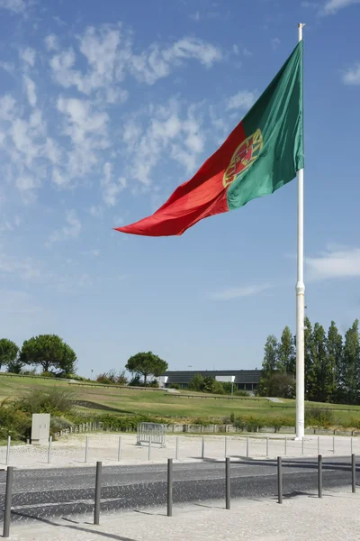Flag of Portugal waving, against blue sky — Stock Photo, Image