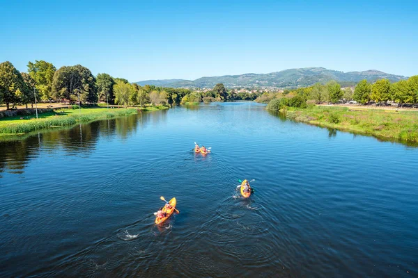 stock image Group of people kayaking in the river Lima in a sunny day. Ponte de Lima, Portugal.