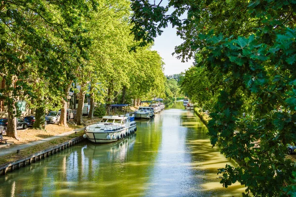 Boats moored in the Canal du Midi in Carcassonne, France.
