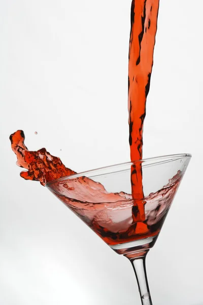 Red wine pouring Stock Photo