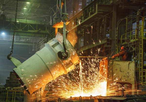 Steel worker takes a sample of hot metal — Stock Photo, Image