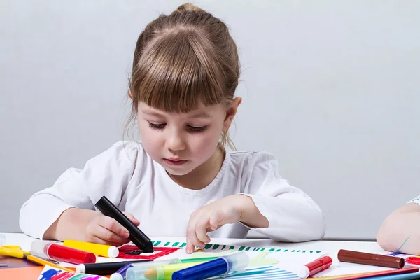 Beautiful little girl draws felt-tip pens Stock Image