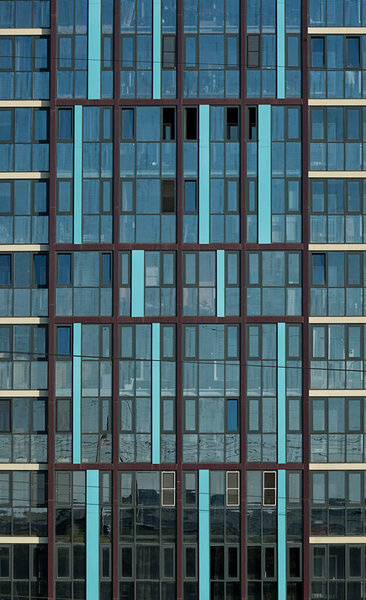 Facade of a multi-storey building, glazed wall, skyscraper windows