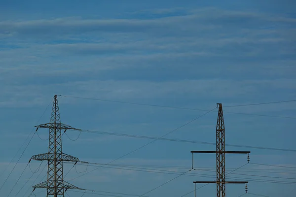 Power Lines Blue Sky Background Metal Structures Electric Transmission Lines — Stockfoto