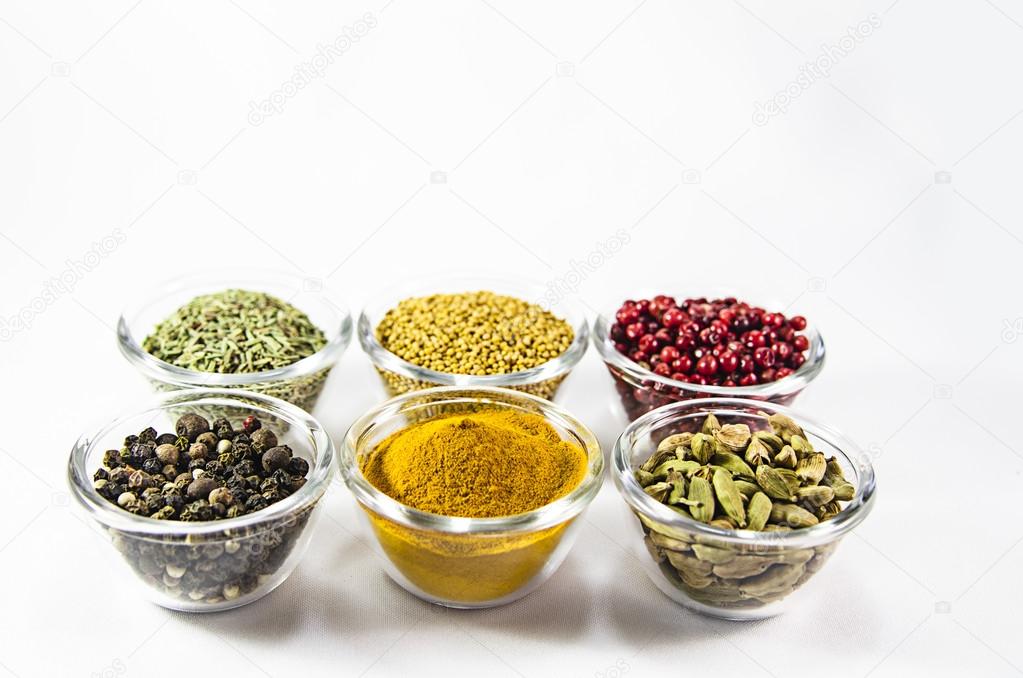 Colorful spices in glass containers