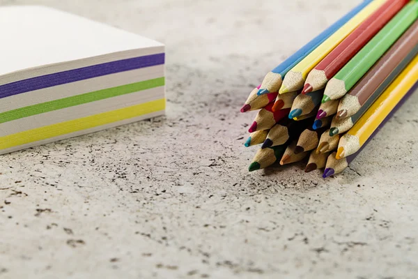 Colored pencils on the desktop — Stock Photo, Image