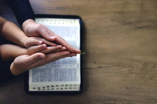 Religious Christian Girl Praying Her Mother Indoors Bible Background Space — Stock Photo, Image