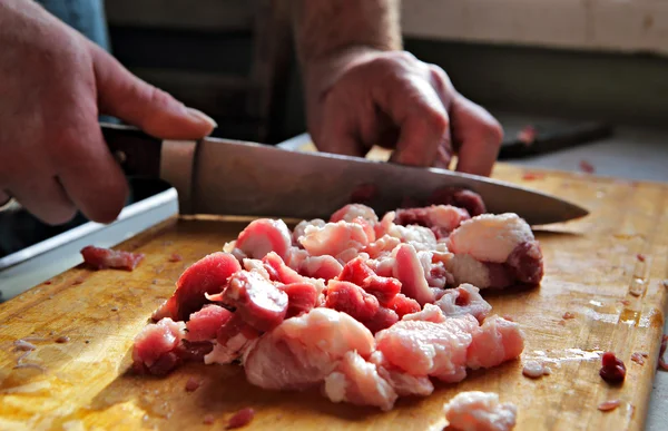 Classical cuisine, cutting meat with a knife — Stock Photo, Image
