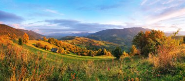 September rural scene in mountains. Autumn hill panorama clipart