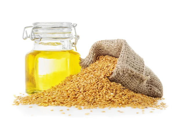 Linseed oil and golden flax seeds — Stock Photo, Image