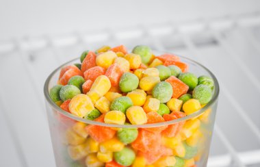 frozen vegetables in a glass in the freezer clipart