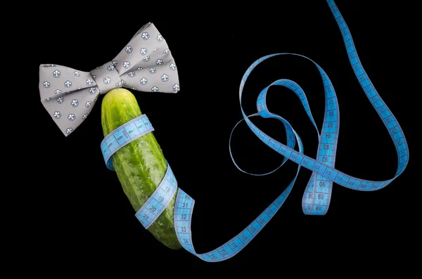 Big cucumber like the penis, centimeter and bow-tie
