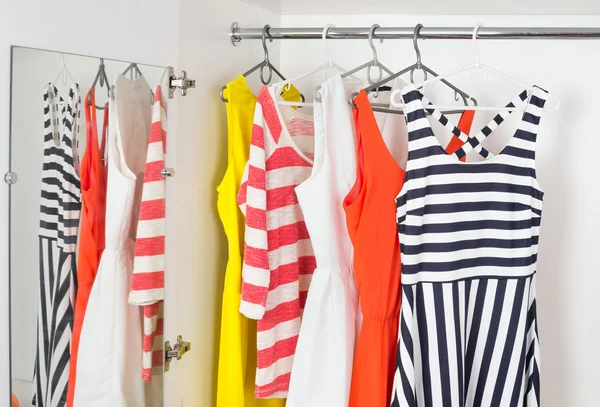 Fashion womens dresses on hangers — Stock fotografie
