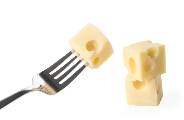 Kousek sýra na železné vidlice — Stock fotografie