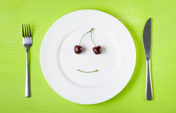 Rosto sorridente de cerejas — Fotografia de Stock