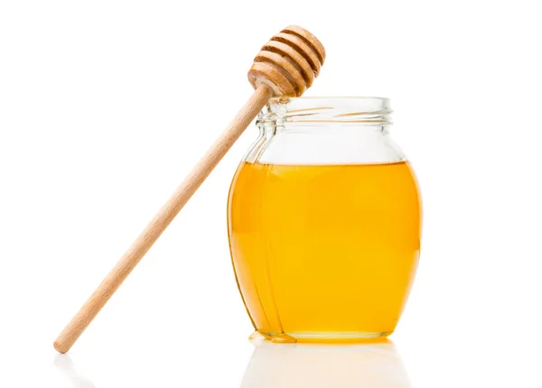 Natural honey in a glass jar — Stock Photo, Image